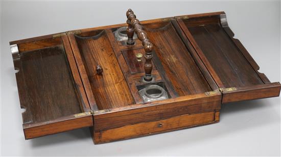 A William IV rosewood writing box, with rectangular double flap lifting top, enclosing covered section and two width 26cm